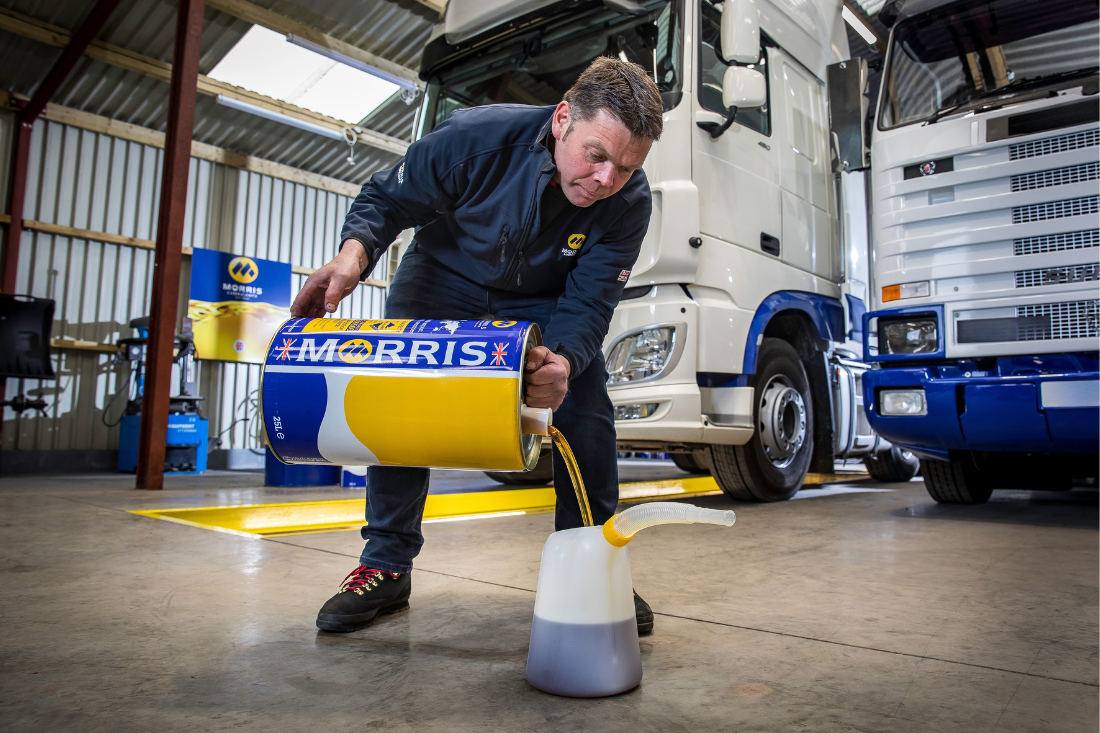 Dave Jenkins pouring Morris Lubricants commercial vehicle engine oil
